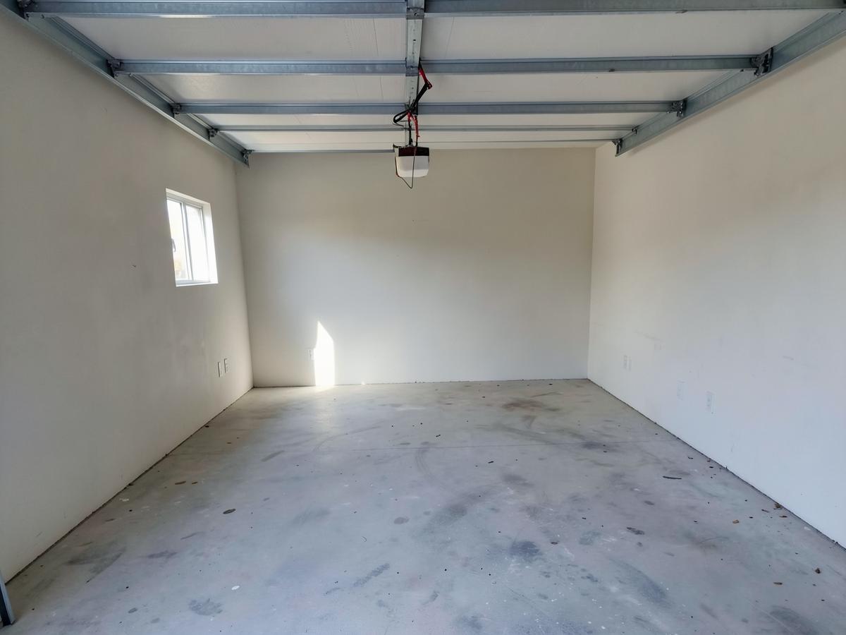 Empty swept garage after a Falcon Construction cleanout in Hardin County, TN